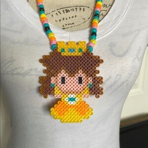 Nintendo princess daisy — yellow —beaded character Mario necklace — black light